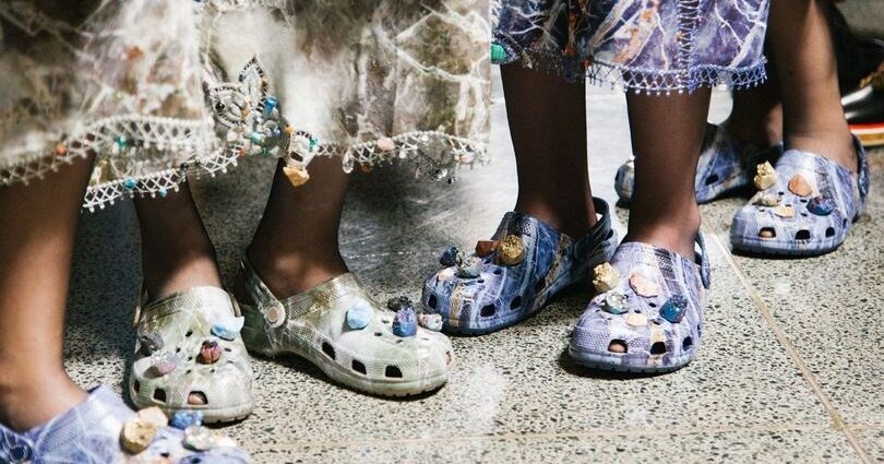 Photo of crocs embedded with healing crystals
