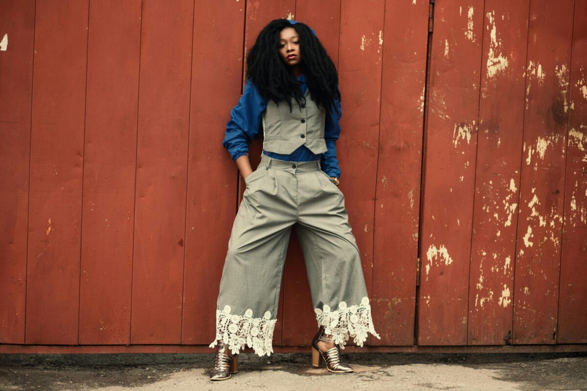 Woman wearing grey Zoot suit style trousers with waistcoat